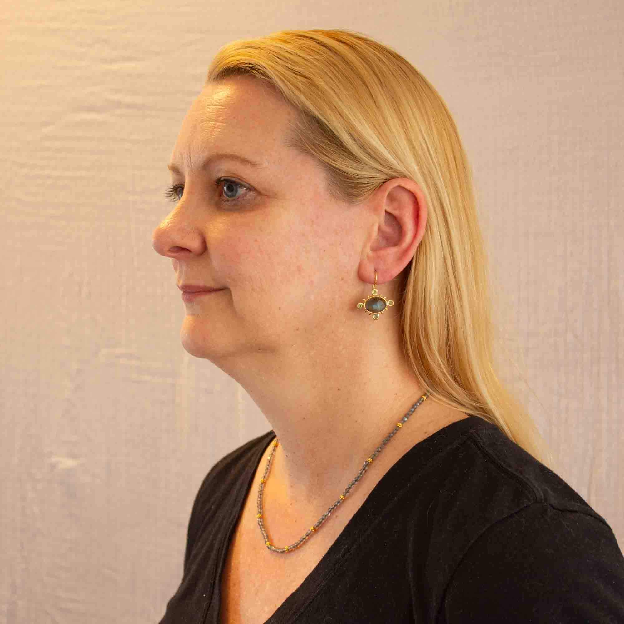 Model wearing Labradorite with Peridot Gemstone earrings in 18k gold vermeil with a hook fitting and labradorite beaded necklace- Beyond Biasa