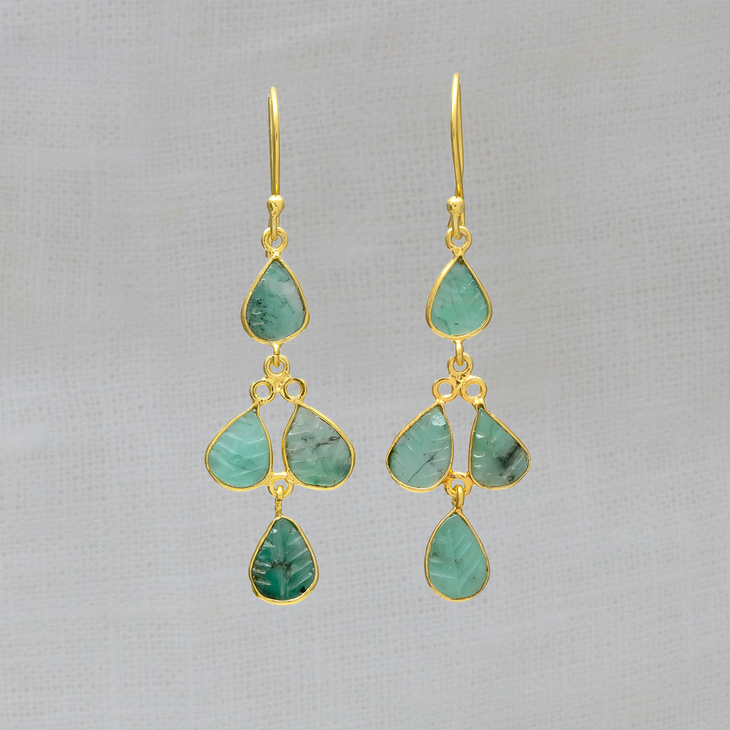 Drop earrings featuring 4 small leaf shaped carved emerald gemstones in a simple 18k gold vermeil setting, with a hook fitting