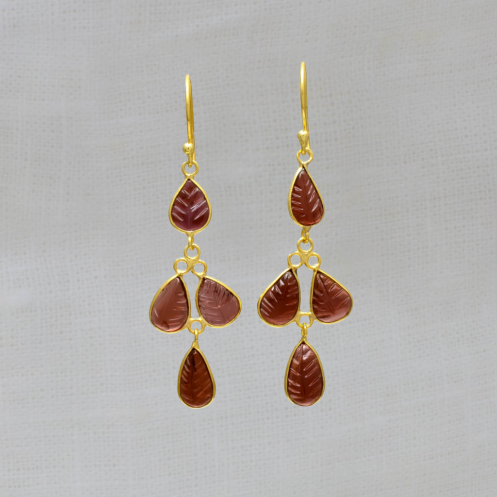 Dangle drop earrings featuring carved garnet gemstones in a simple 18k gold vermeil setting, with a hook fitting.
