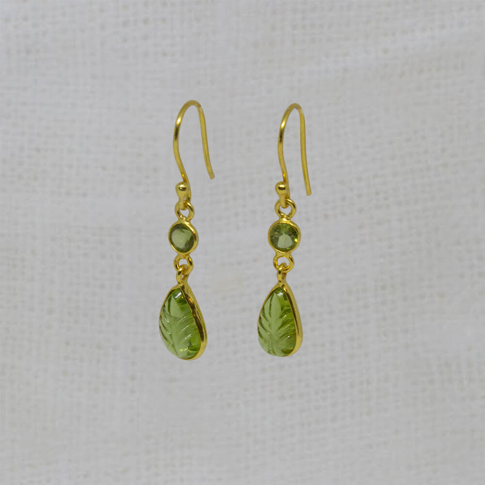 Carved and faceted peridot gemstone earrings in 18k gold vermeil with a simple hook fitting - Beyond Biasa