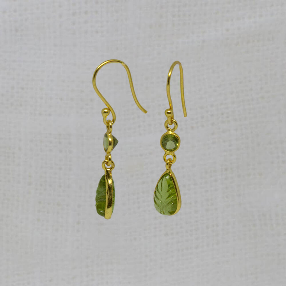 Carved and faceted peridot gemstone earrings in 18k gold vermeil with a simple hook fitting - Beyond Biasa