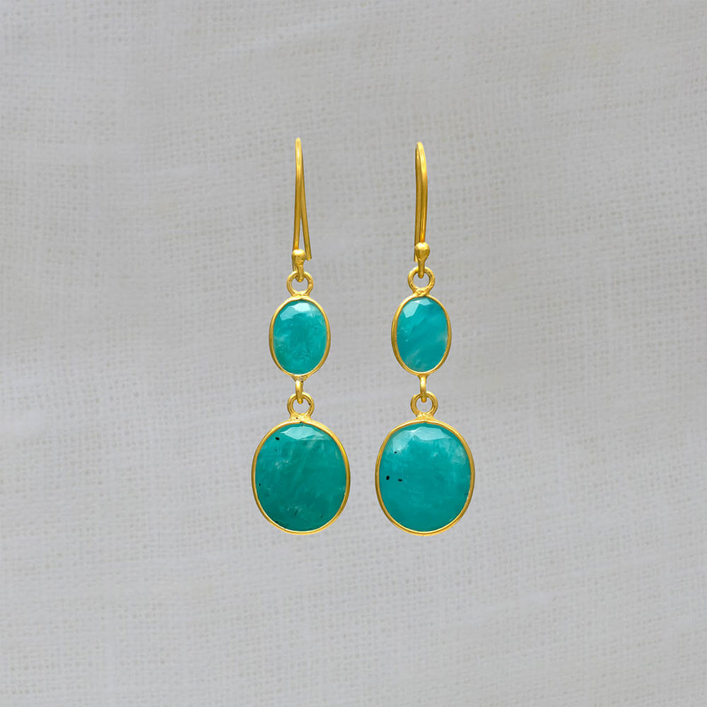A pair of dangle drop earrings featuring two oval shaped amazonite gemstones set in a simple 18k gold vermeil setting with hook fitting