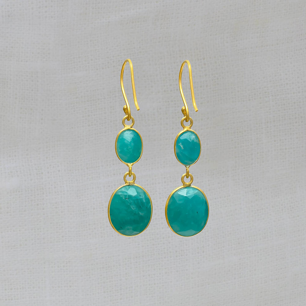 A pair of dangle drop earrings featuring two oval shaped amazonite gemstones set in a simple 18k gold vermeil setting with hook fitting
