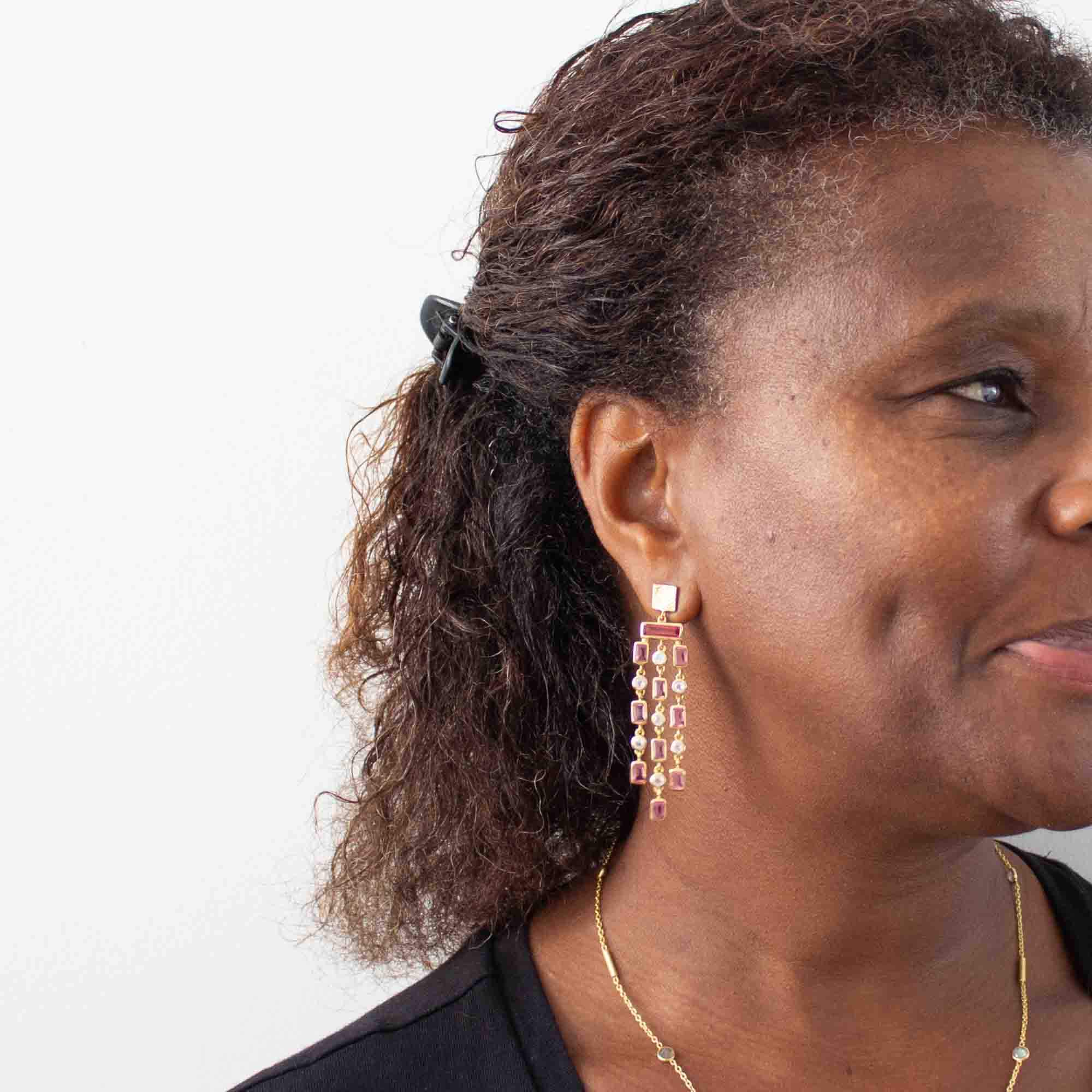 Model wearing pink quartz and rainbow moonstone gemstone triple row chandelier style dangle earrings with textured gold vermeil stud fitting - Beyond Biasa