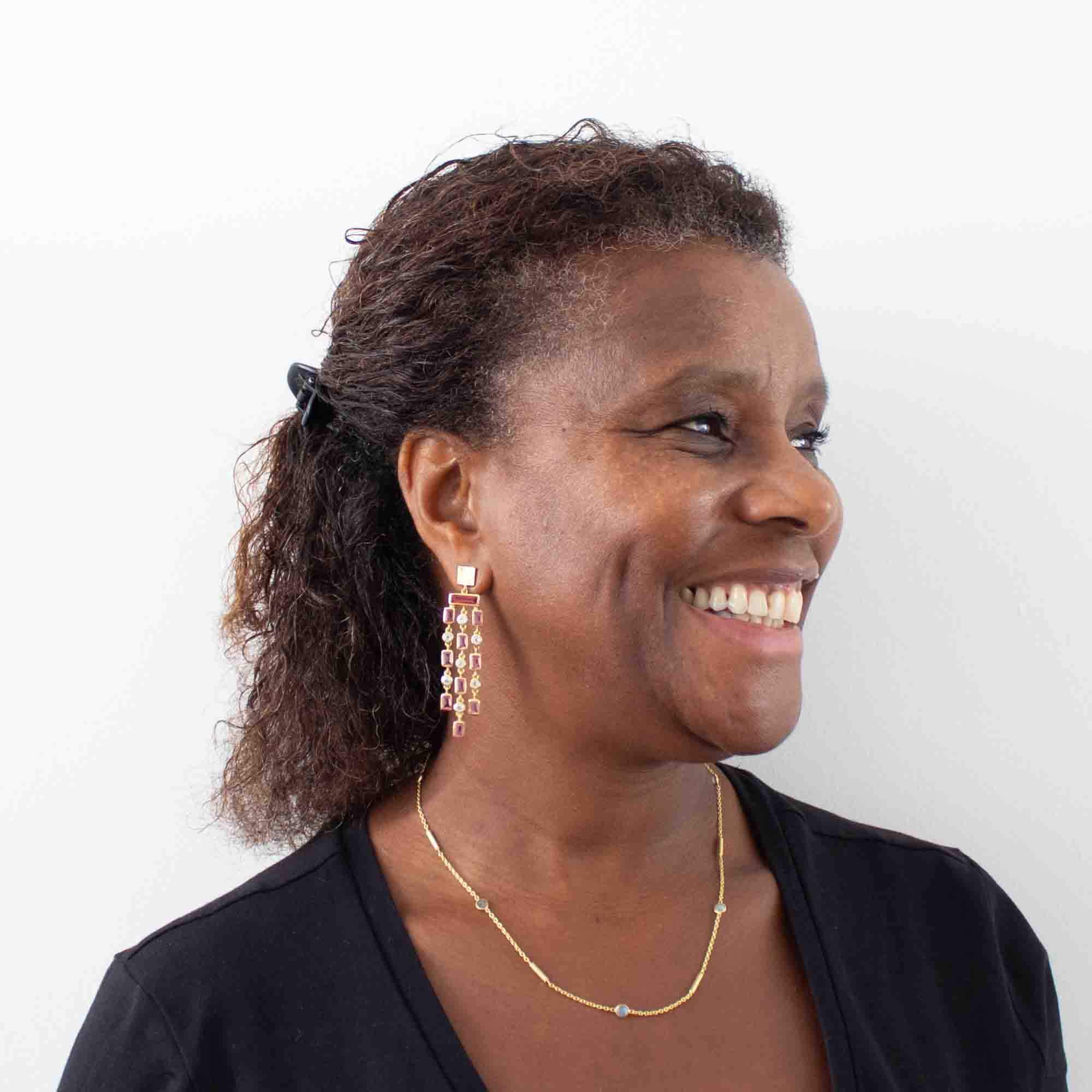 Model wearing pink quartz and rainbow moonstone gemstone triple row chandelier style dangle earrings with textured gold vermeil stud fitting - Beyond Biasa