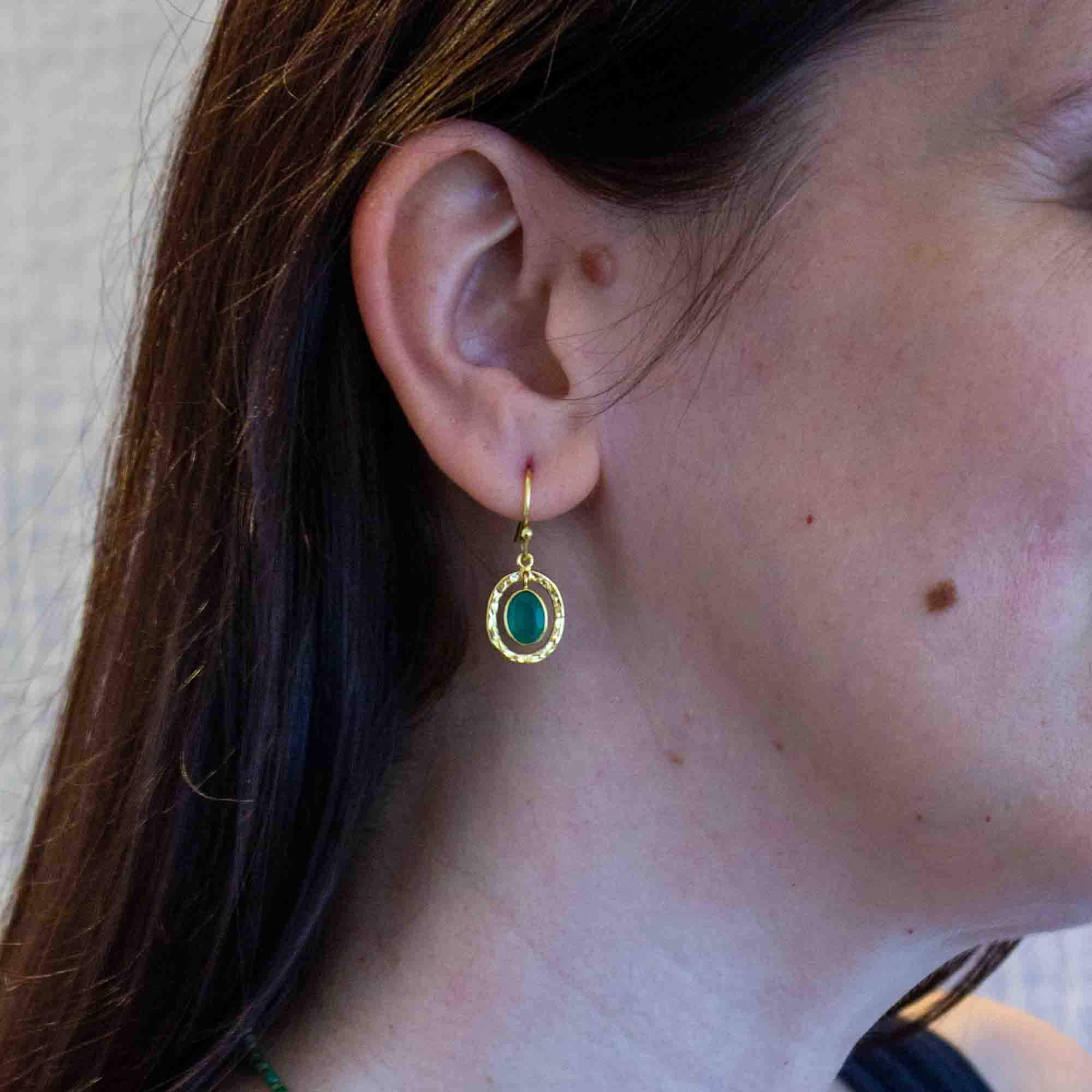 Model wearing Green onyx gemstone and 18k gold vermeil hammered oval drop earrings with hook fittings - Beyond Biasa
