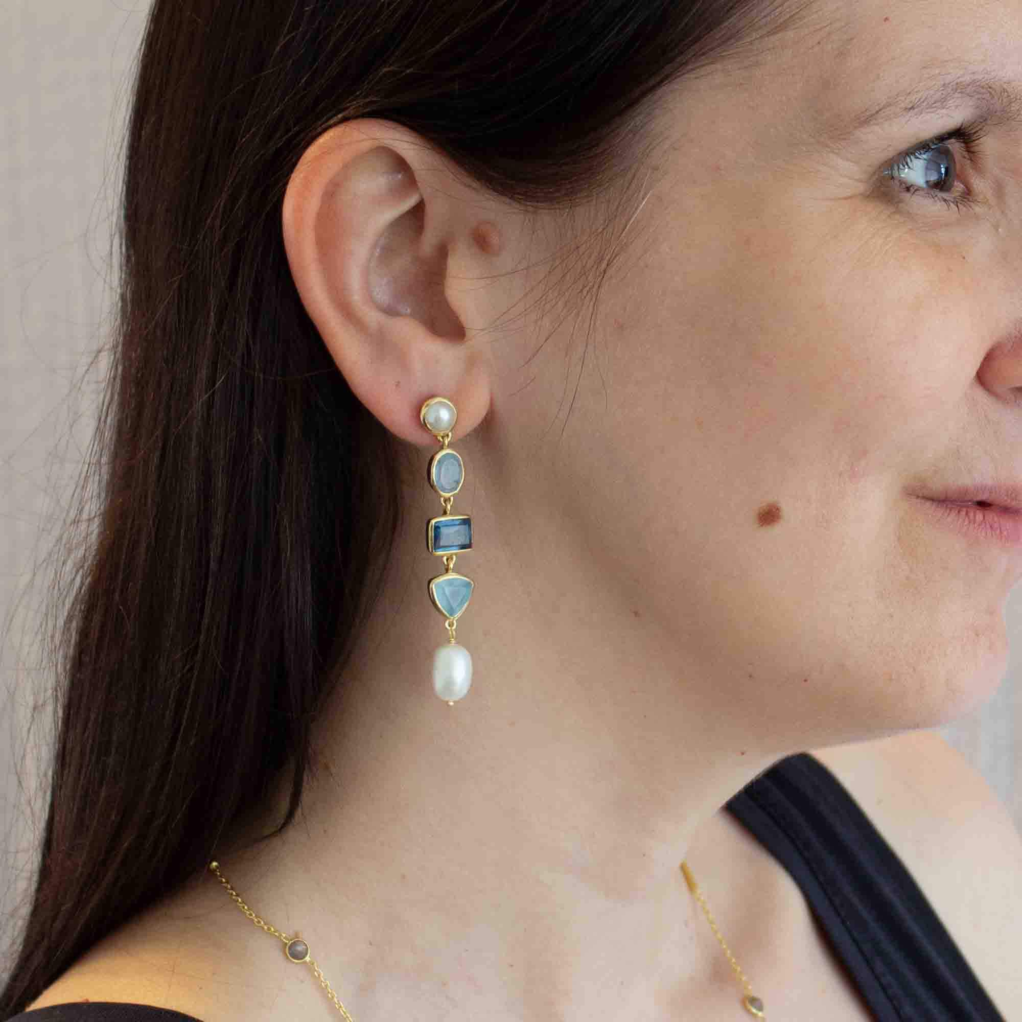Model wearing Long gemstone multi stone dangle earrings in 18k gold vermeil, with freshwater pearl, blue chalcedony and kyanite - Beyond Biasa