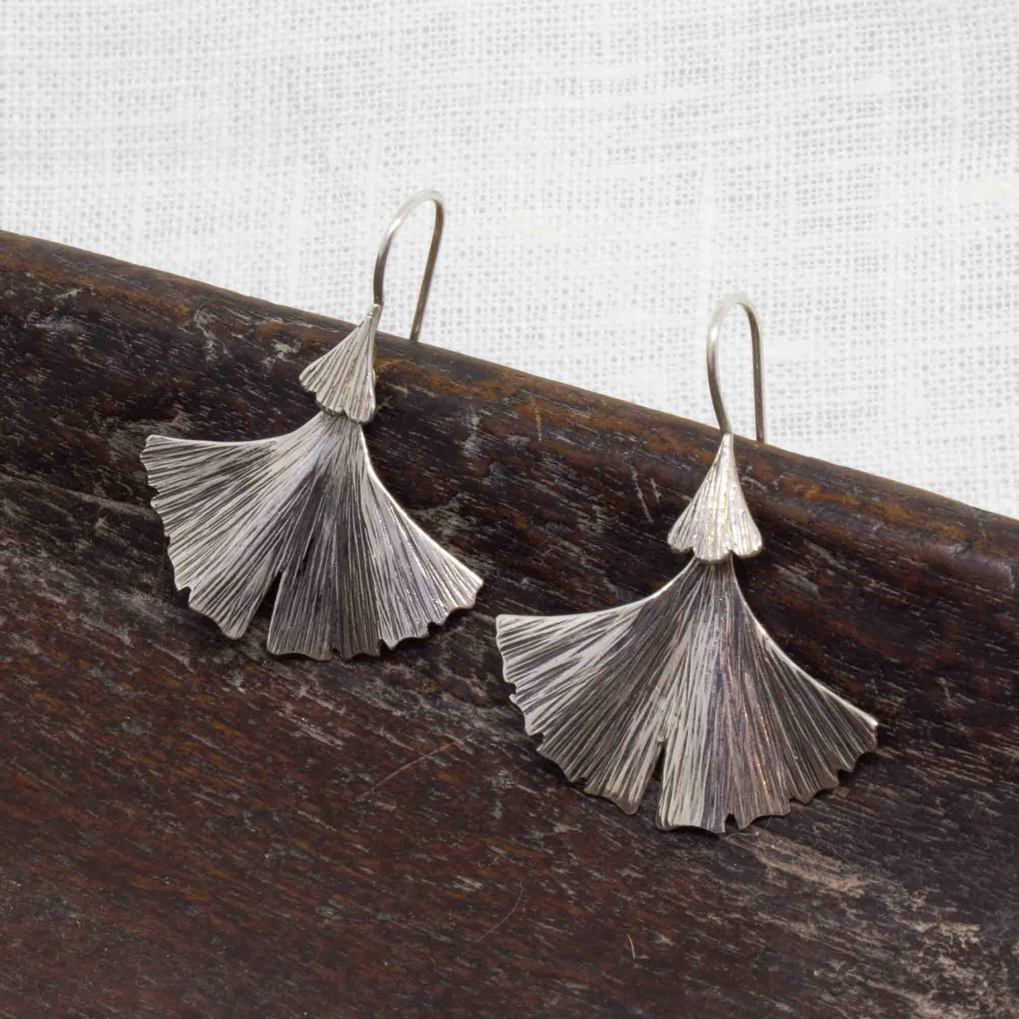 Sterling silver oxidised and textured fan shaped ginkgo leaf earrings with a hook fitting - Beyond Biasa