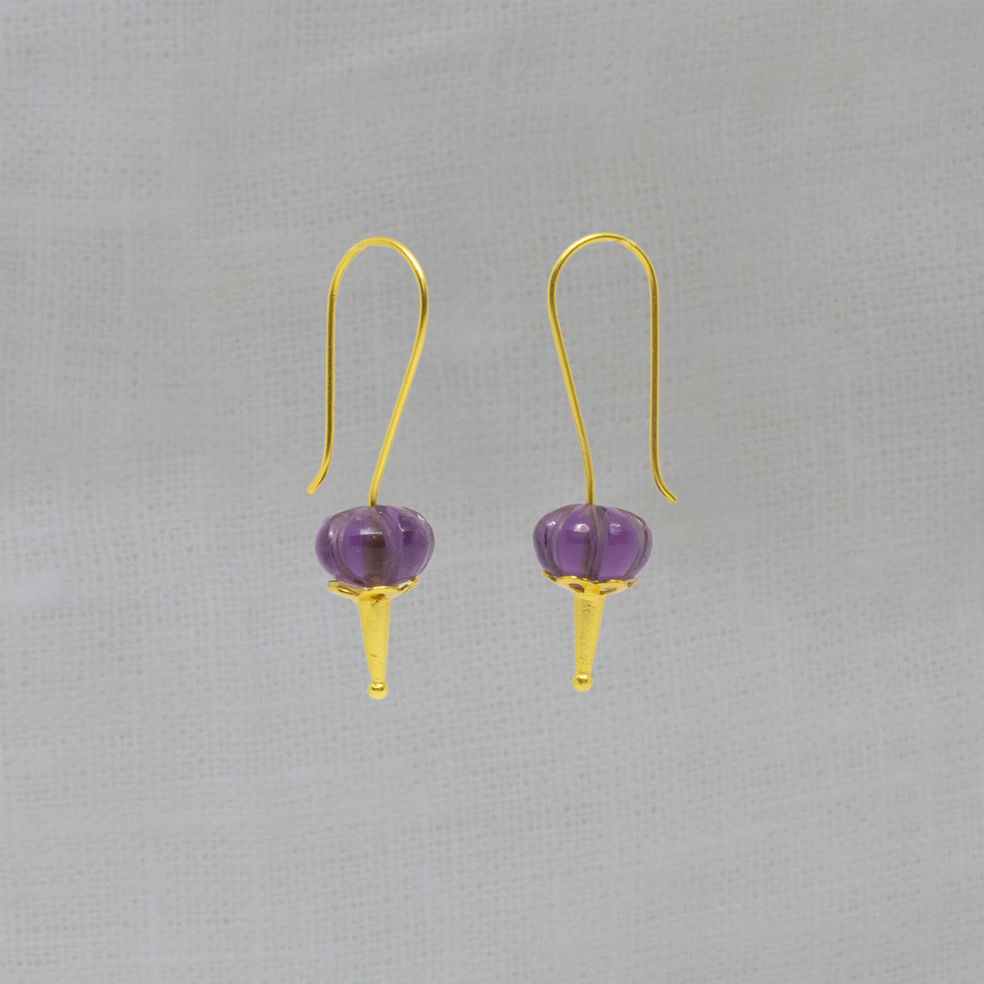 Long hook drop earrings in 18k gold vermeil with carved melon cut amethyst gemstones - Beyond Biasa