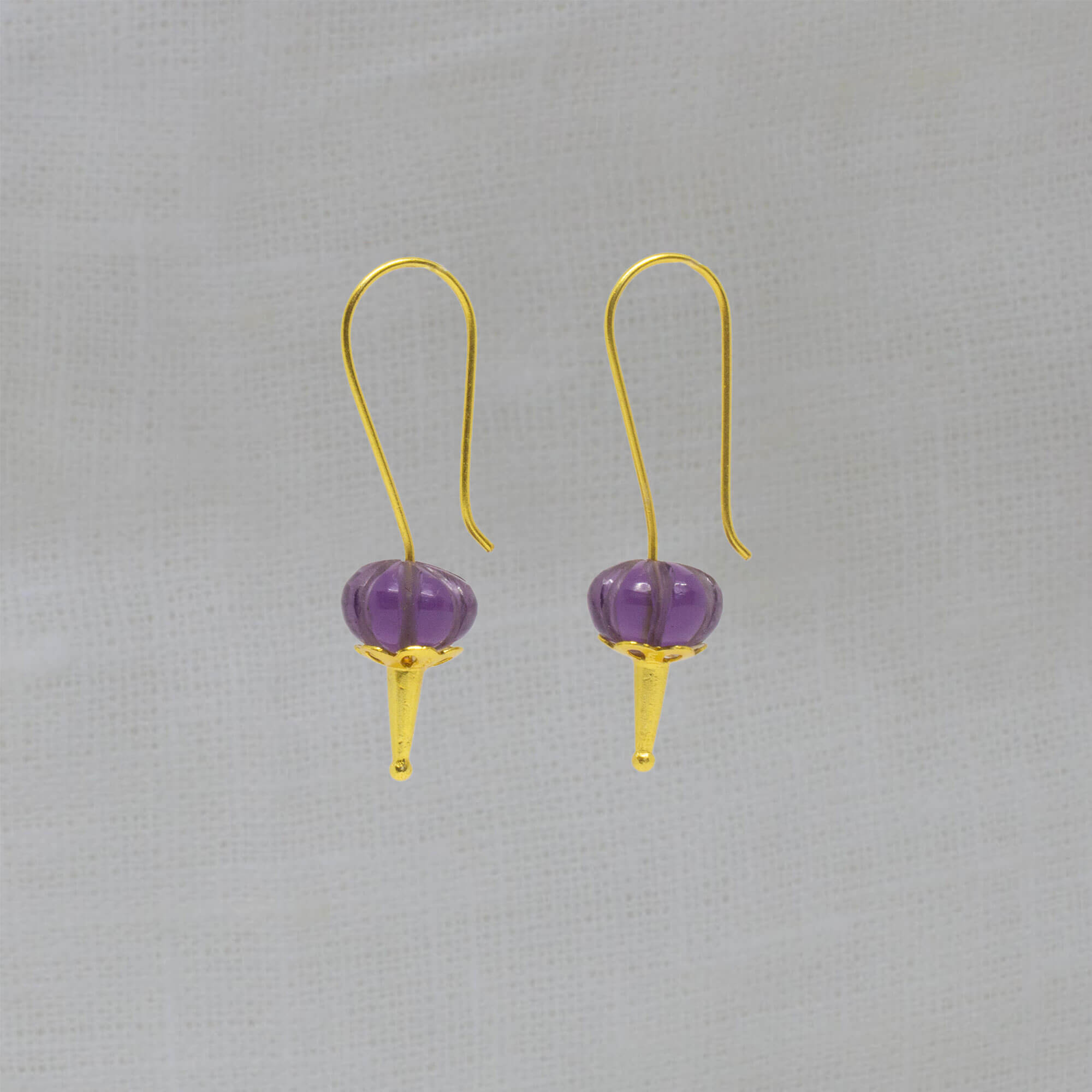 Long hook drop earrings in 18k gold vermeil with carved melon cut amethyst gemstones - Beyond Biasa