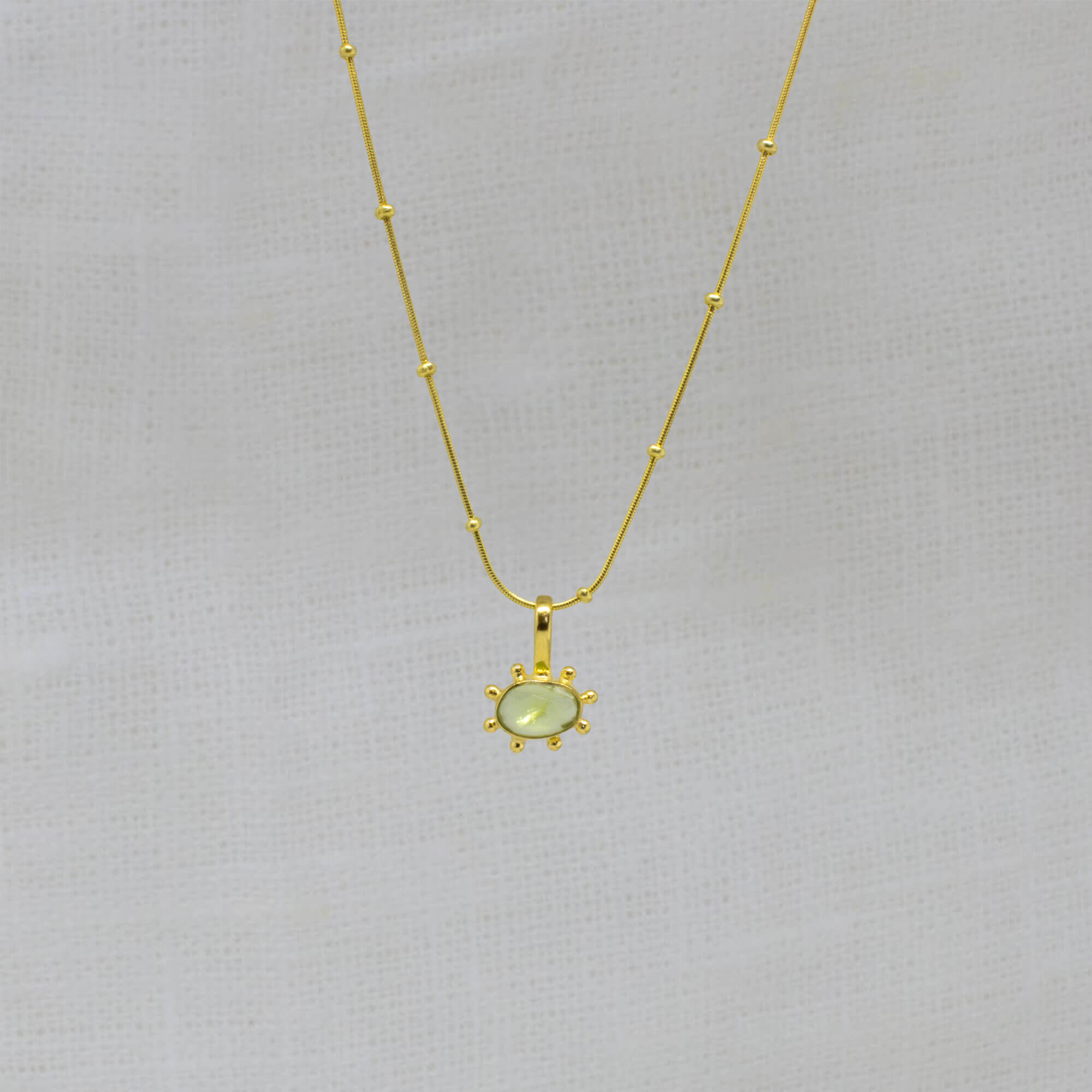 Peridot gemstone irregular pendant necklace in 18k gold vermeil with studded gold snake chain - Beyond Biasa