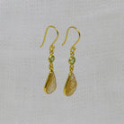 Carved citrine and faceted peridot gemstone earrings in 18k gold vermeil with a simple hook fitting - Beyond Biasa 