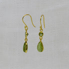 Carved and faceted peridot gemstone earrings in 18k gold vermeil with a simple hook fitting - Beyond Biasa 