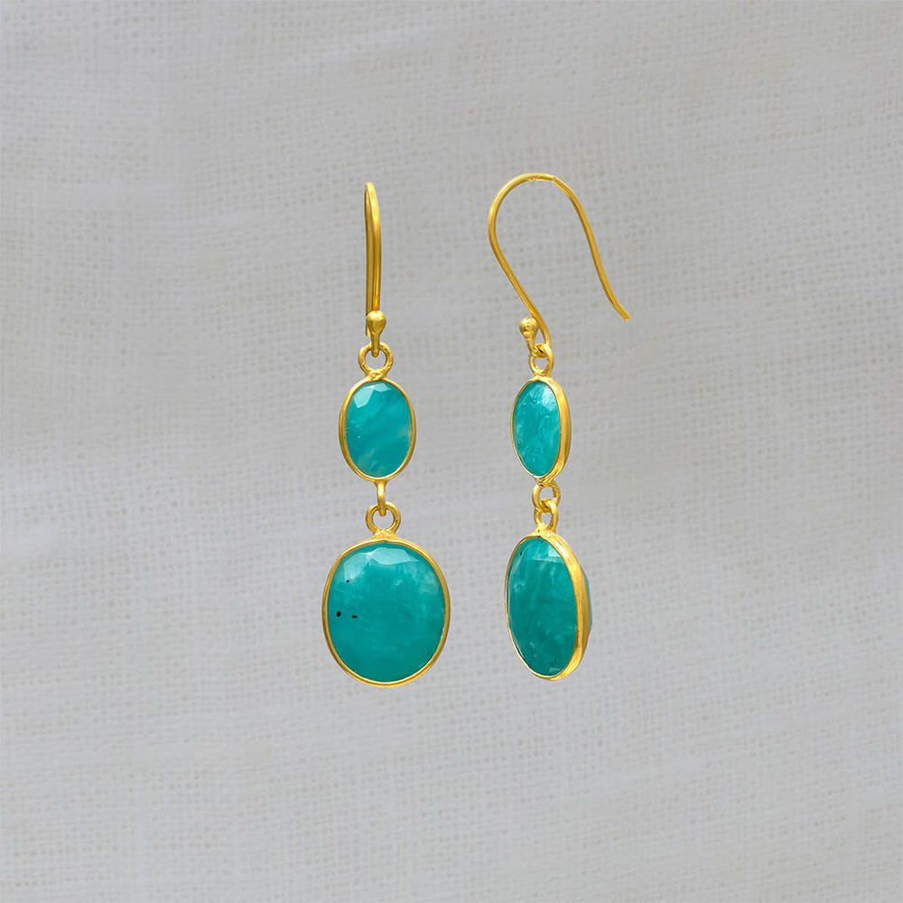 A pair of dangle drop earrings featuring two oval shaped amazonite gemstones set in a simple 18k gold vermeil setting with hook fitting