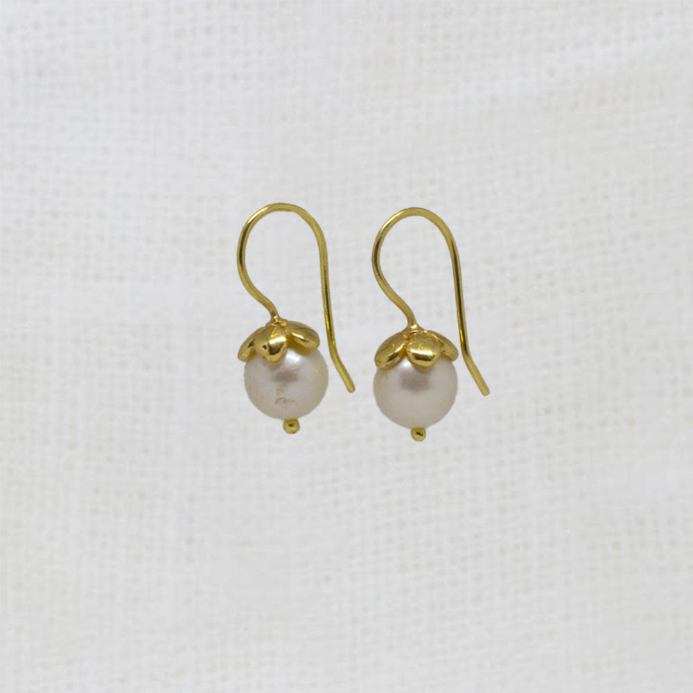 Round white freshwater pearl earrings with gold vermeil hooks and flower cap | Beyond Biasa