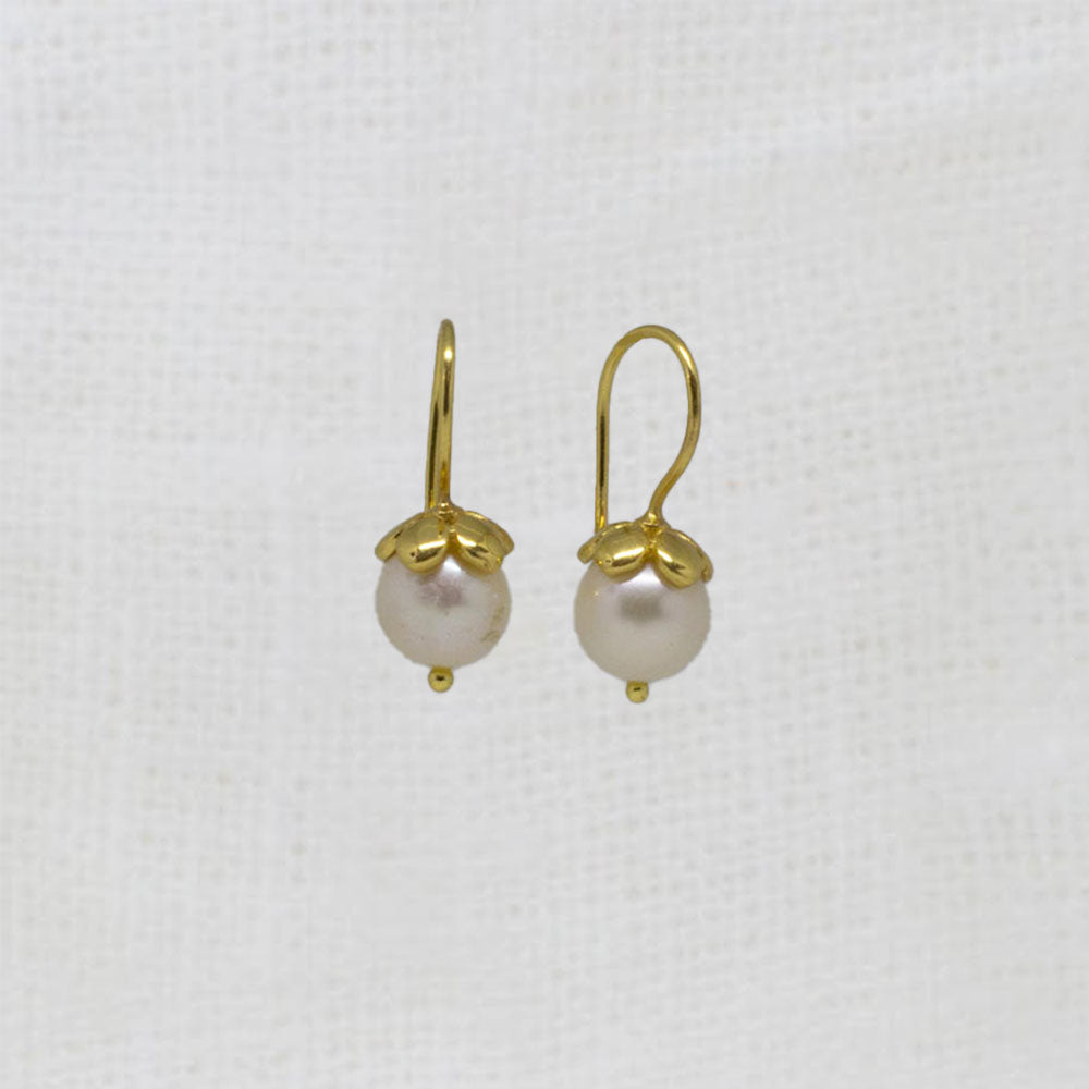 Round white freshwater pearl earrings with gold vermeil hooks and flower cap | Beyond Biasa