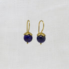 Round blue lapis lazuli gemstone earrings with gold vermeil hooks and flower cap | Beyond Biasa