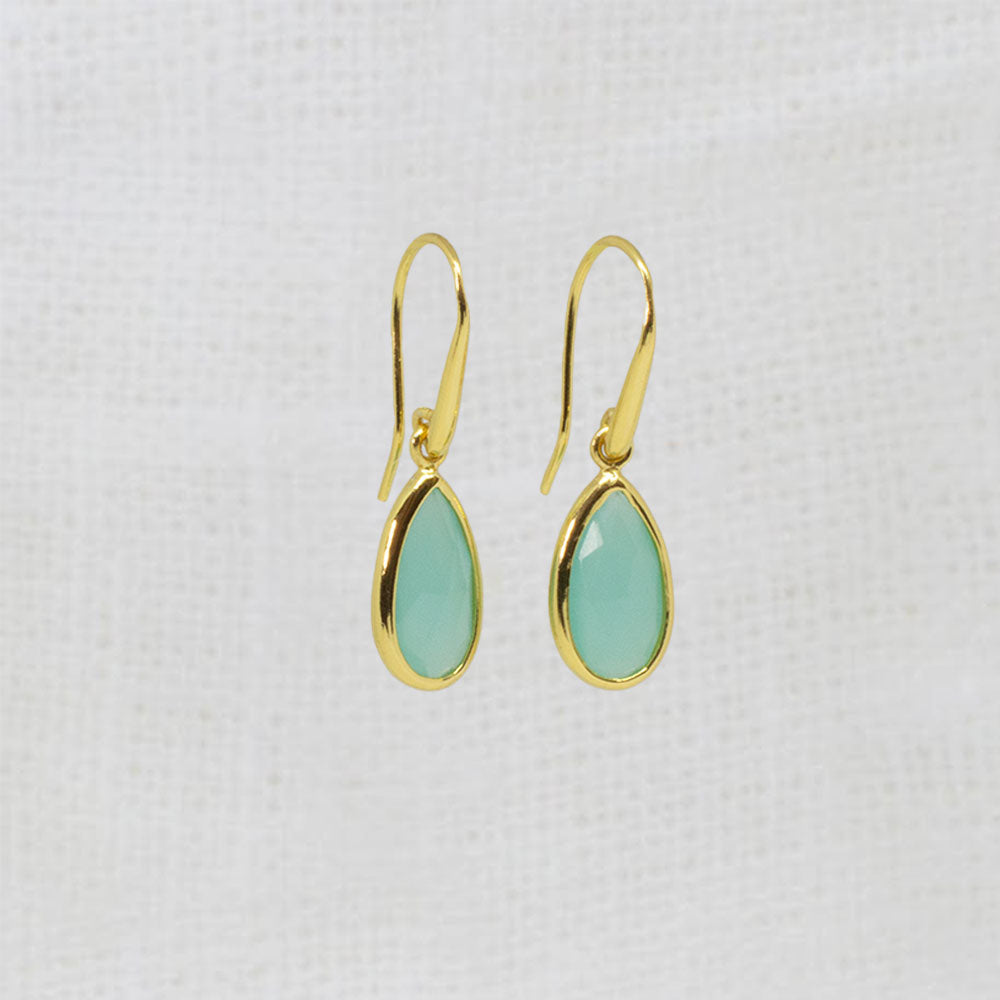 A pair of gold drop earrings with teardrop-shaped aqua chalcedony gemstones. 