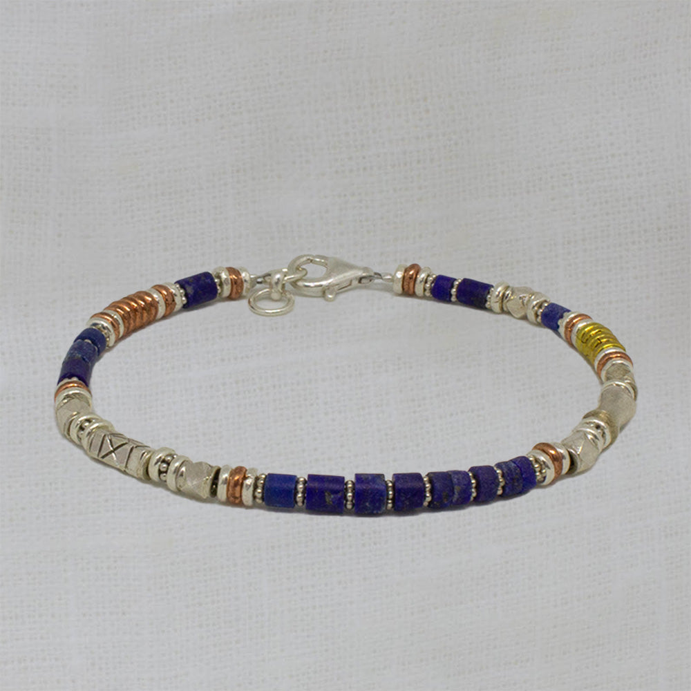 Gemstone beaded bracelet with lapis lazuli, sterling silver, copper and brass beads.