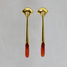 Long statement earrings in 18k gold vermeil with a curved stud and long drop with faceted carnelian gemstone