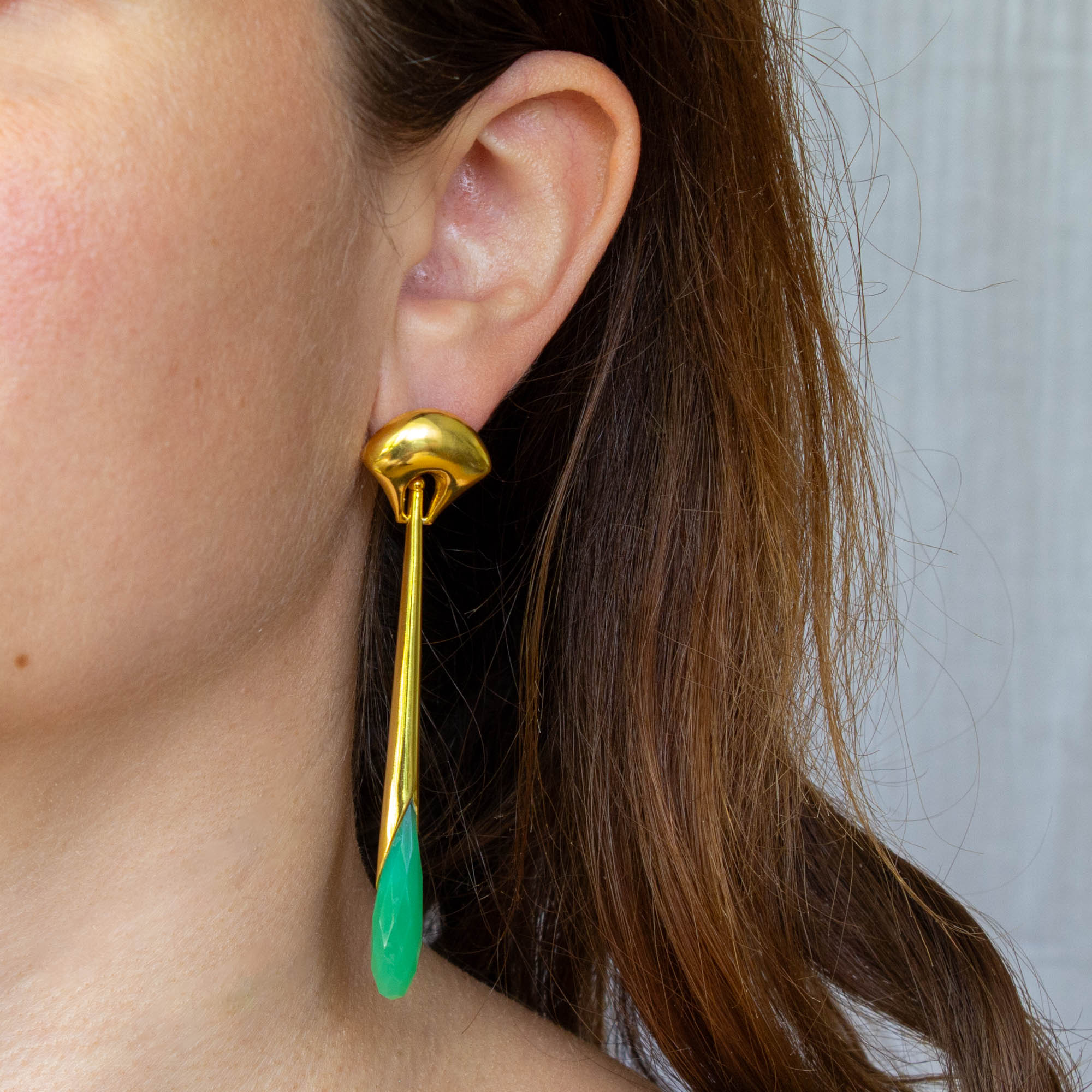 Long statement earrings in 18k gold vermeil with a curved stud and long drop with faceted chrysoprase gemstone