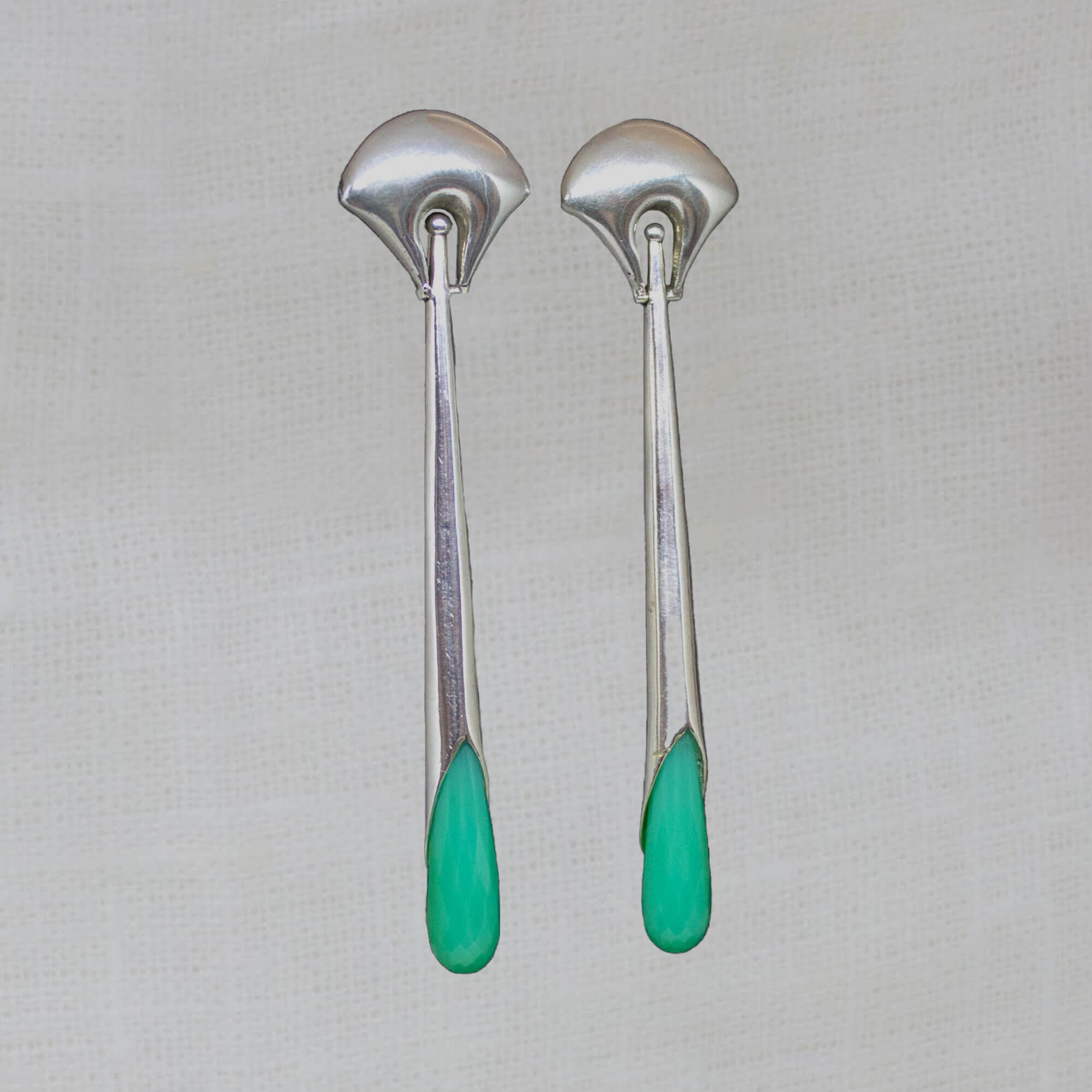 Long statement earrings in 18k gold vermeil with a curved stud and long drop with faceted chrysoprase gemstone