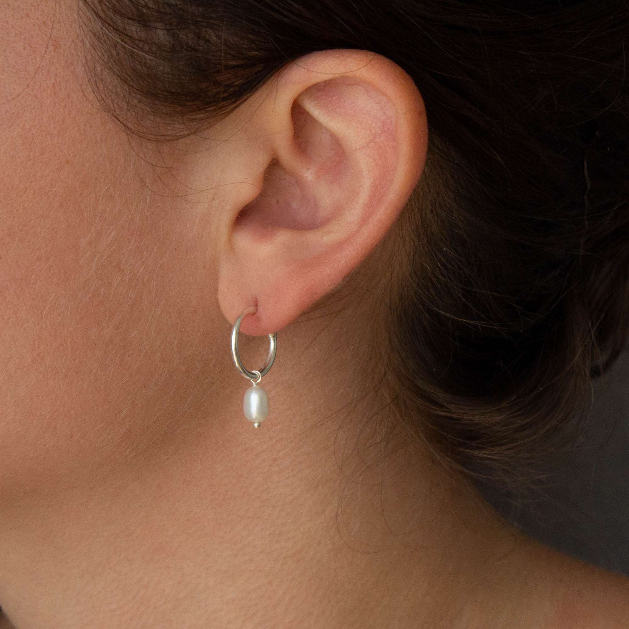 Sterling Silver hoop earrings with white freshwater pearl charms and a stud fitting - Beyond Biasa