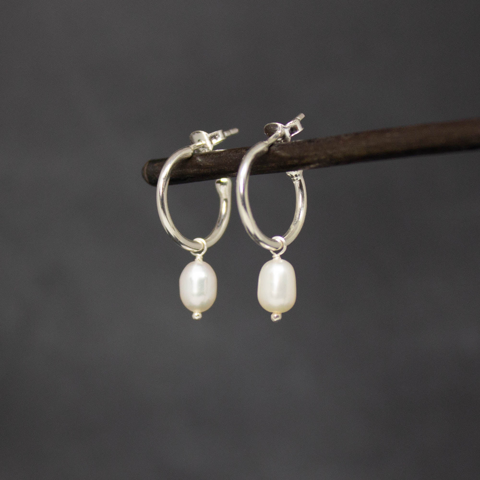 Sterling Silver hoop earrings with white freshwater pearl charms and a stud fitting - Beyond Biasa