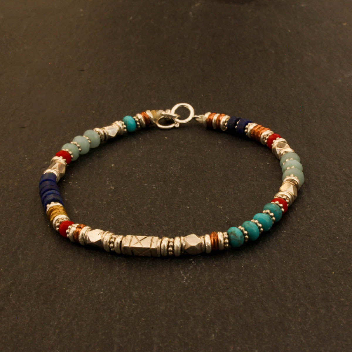 Semi-precious gemstone beaded bracelet with turquoise, lapis, amazonite and coral and silver, copper and brass - Beyond Biasa 