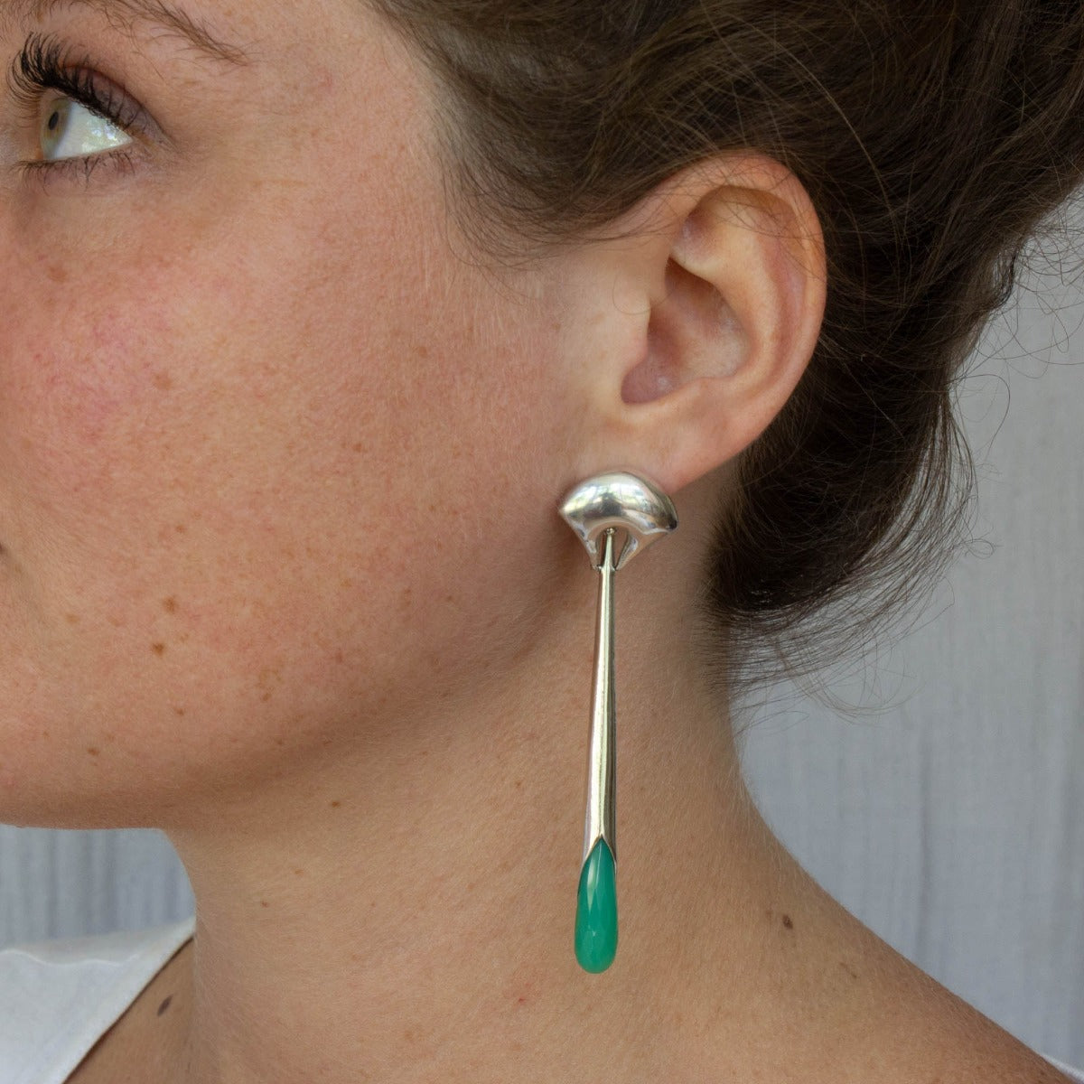 Long statement earrings in 18k gold vermeil with a curved stud and long drop with faceted chrysoprase gemstone