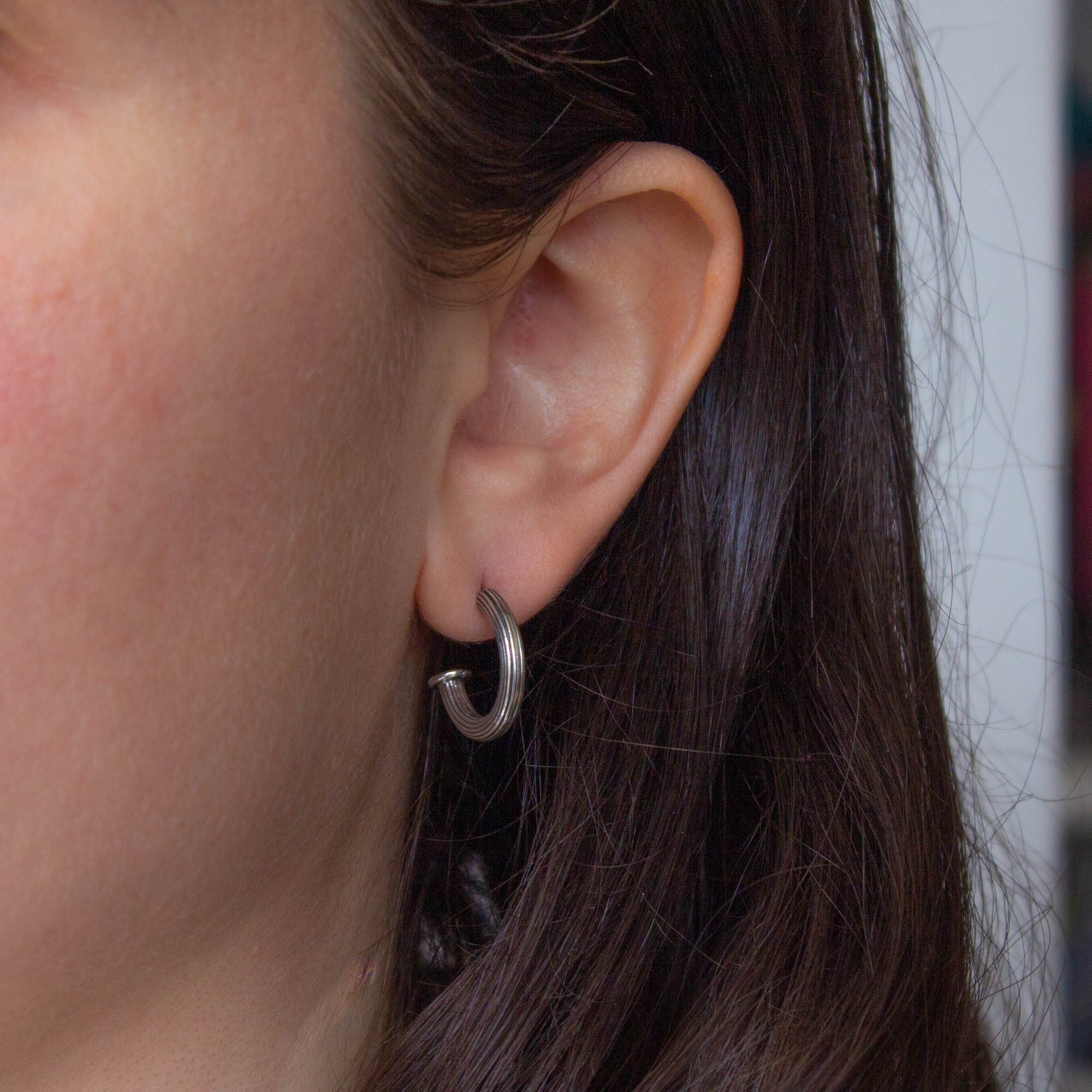 Model wearing Oxidised Silver Ridged Hoop Earrings with Stud Fitting | Beyond Biasa